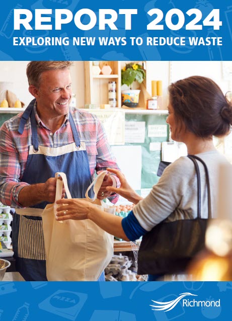 annual report cover a man hands a woman a reusable grocery bag