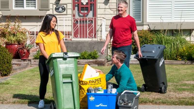 people putting out their recycling