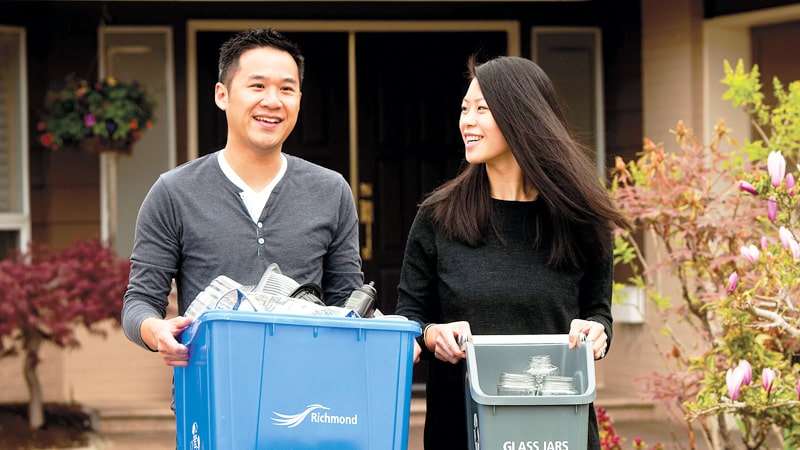 man carrying blue container woman carrying glass