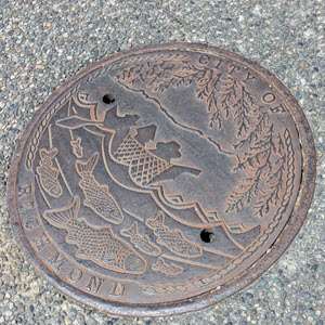 View of an access cover with public art in Steveston