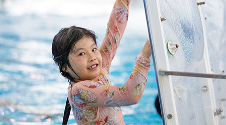 Girl on climbing wall at Minoru Centre for Active Living pool