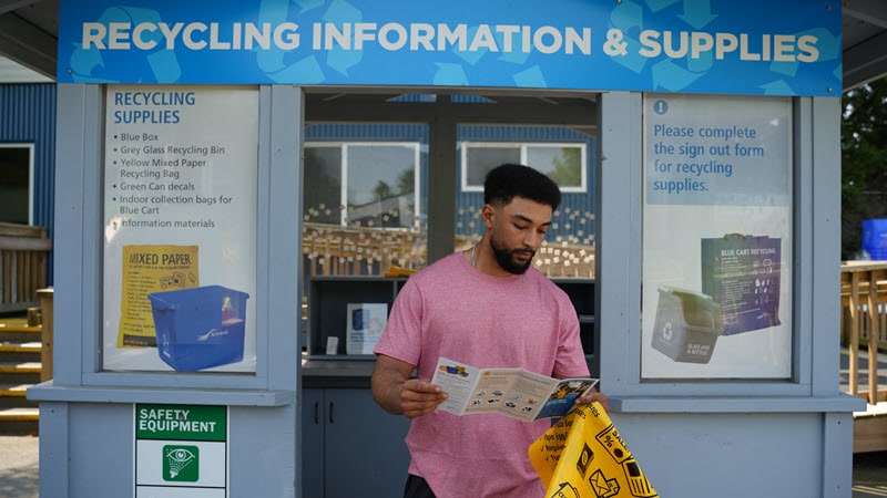 man looking at brochure at depot