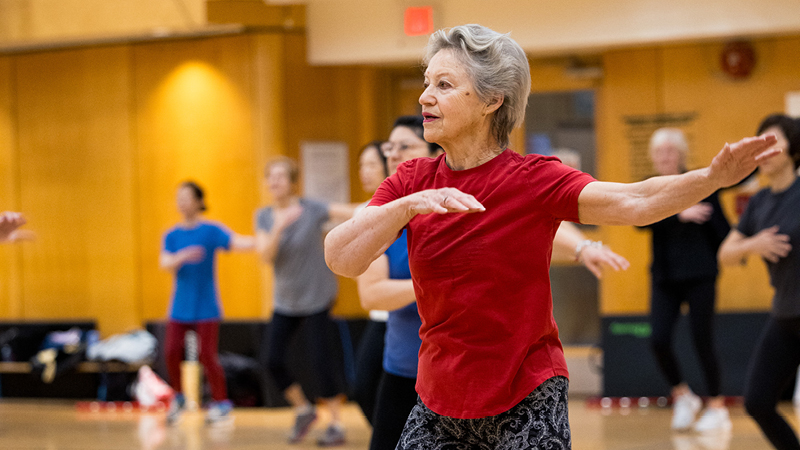 Adults doing group fitness class