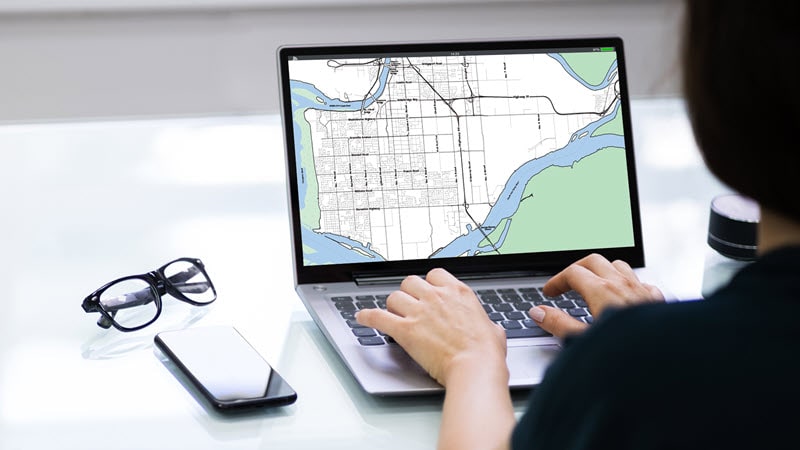 View of someone searching for housing on a laptop