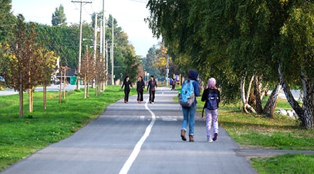 Photo of Railway Greenway path with several distant pedestrians