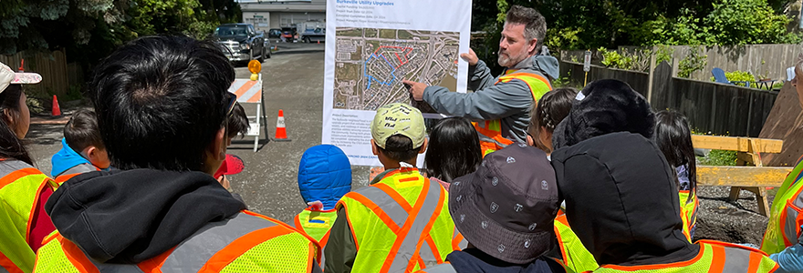 City staff teaching a group of students