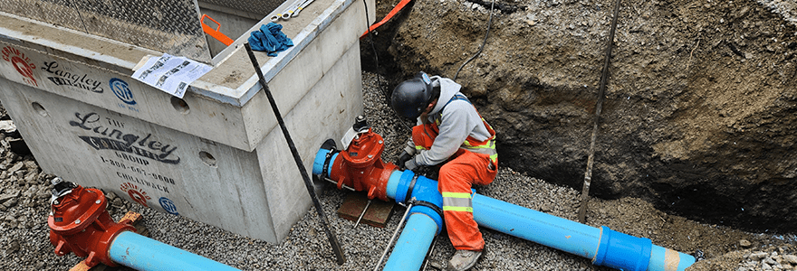 City employee working in an excavated trench