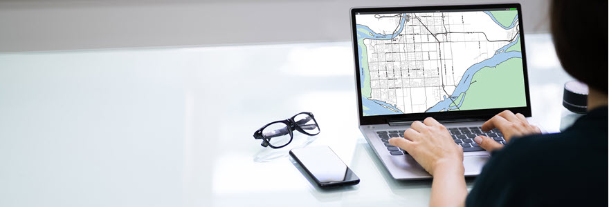 View of someone searching for housing on a laptop