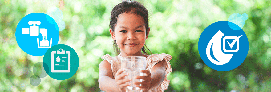 Girl holding glass of water