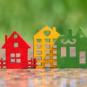 painted cutouts of wooden houses