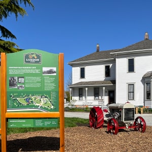 London Farm sign and view of the house