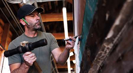 Shipwright Dave Sharp works on the restoration of the Japanese Canadian-built Crystal S in the Richmond Boat Builders workshop at Britannia Shipyards National Historic Site.