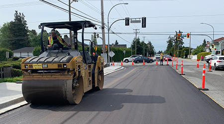 View of a paving machine paving a Richmond street