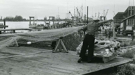 Working on fishing nets at Steveston, ca. 1967