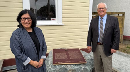 Tenney Homma, granddaughter of Tomekichi Homma, and Mayor Malcolm Brodie celebrate the National Historic Event plaque’s new permanent home at the Steveston Japanese Canadian Museum.