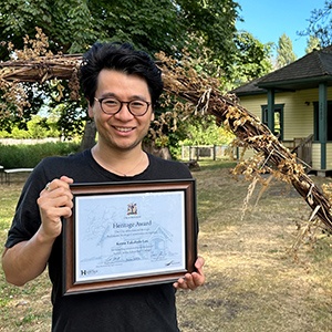 Kevin Takahide Lee in front of the Edwardian Cottage