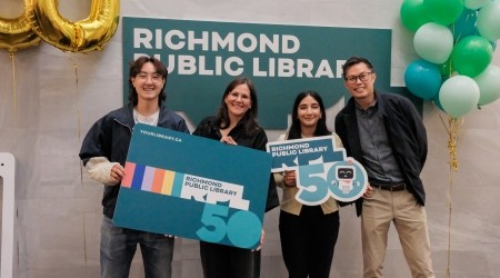 Group of people posing for a photo at Richmond Public Library's 50th birthday launch event