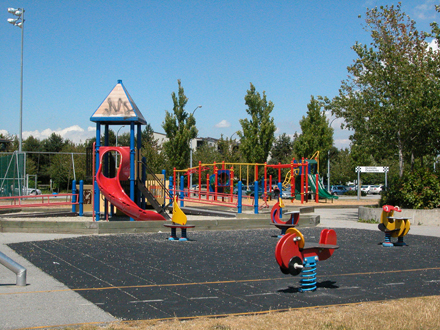 Burnett/Thompson Park - north facing view of east playground, adjacent to community centre