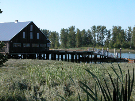 View of Britannia heritage shipyard building facing south, from boardwalk